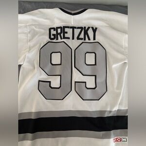 CCM White and Black Hockey Jersey with Number 99